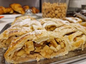 a bunch of pastries sitting on a tray at Hotel Danubio in Lido di Jesolo