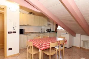 a kitchen with a table and chairs in a room at Villa Marta in Mazzin