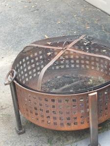a wicker basket sitting on top of a sidewalk at Watersmeet cottages in Dullstroom