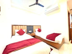 En eller flere senge i et værelse på The Gonesh Hotel