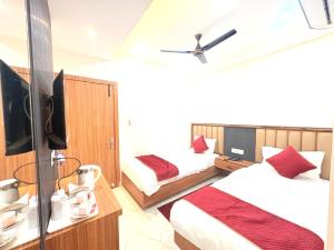 En eller flere senge i et værelse på The Gonesh Hotel