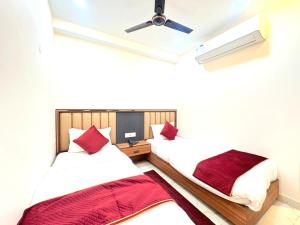 En eller flere senge i et værelse på The Gonesh Hotel