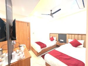 En eller flere senge i et værelse på The Gonesh Hotel