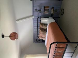 a small room with a bed in a room at Chapel House Estate in Kent