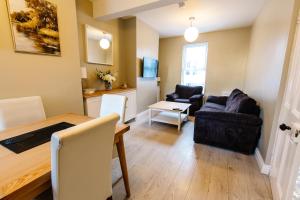 a living room with a couch and a table at The Nines in Bangor +80 photos