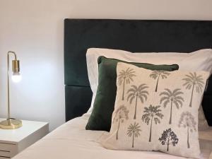 En eller flere senge i et værelse på Aconchego da Vila