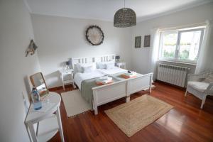 En eller flere senge i et værelse på Sunny Soul