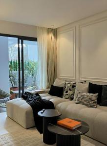 Posezení v ubytování New Architect & Design Studio - CFC & Maarif + 4 fotografie