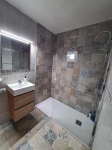a bathroom with a shower and a sink at Jurgita Apartment in Los Llanos de Aridane +8 photos