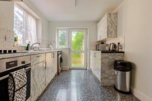 a kitchen with a sink and a counter top at 2Bed by Jubilee Square Maidstone in Maidstone