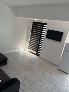 TV a/nebo společenská místnost v ubytování Bloc X4 Bulevardul Dem Radulescu