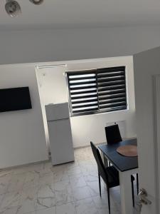 Kuchyň nebo kuchyňský kout v ubytování Bloc X4 Bulevardul Dem Radulescu