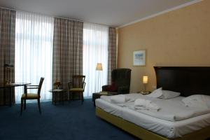 Postel nebo postele na pokoji v ubytování Akzent Hotel Höltje + 21 fotografií
