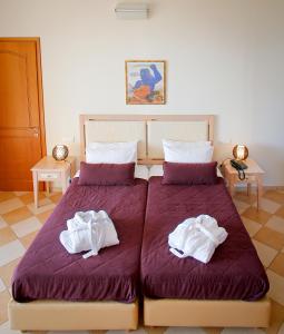 A bed or beds in a room at Sea View Resorts & Spa