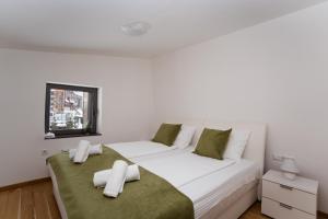 Giường trong phòng chung tại Green Apartments Bjelašnica