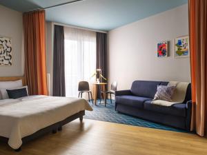 En eller flere senge i et værelse på Numa Berlin Kudamm