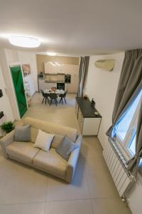 a living room with a couch and a table at ALMAR HOLIDAY - Crotone in Crotone
