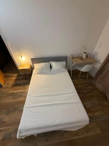 En eller flere senge i et værelse på Chambre hôtes