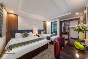 Postel nebo postele na pokoji v ubytování Central Sapa March Hotel