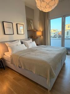 Giường trong phòng chung tại Deluxe Penthouse Goldsteinkoje 1