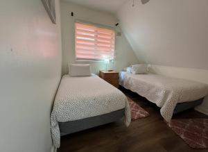 En eller flere senge i et værelse på Casa Hogar Sur