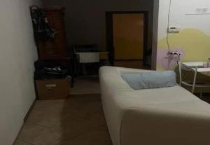 a living room with a couch and a table at SnowPeak Residence in Dresano +6 photos