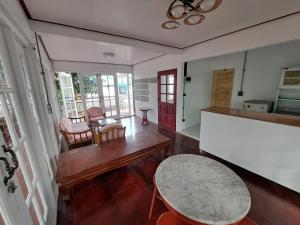 a living room with a table and a table at Casa Scarlet in Bangkok +27 photos