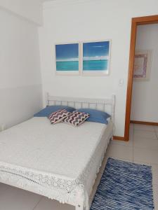 Postel nebo postele na pokoji v ubytování Aproveitando o Sol e o Mar de Torres