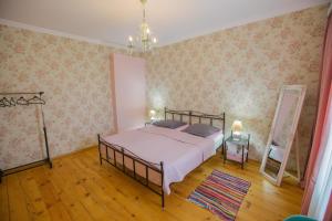 Postel nebo postele na pokoji v ubytování Nino's House