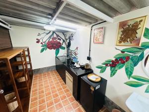 a room with a black counter and flowers on the wall at Laleuca At Laemhad Kohyaoyai in Ko Yao Yai +18 photos