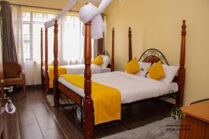 Giường trong phòng chung tại KISE Hotel and Conference Facilities