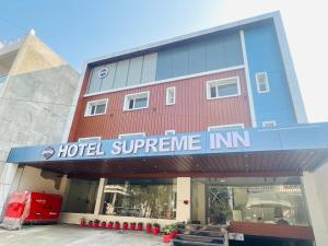 a hotel supreme inn in front of a building at Hotel Supreme Inn in Varanasi