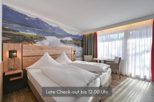 Ένα ή περισσότερα κρεβάτια σε δωμάτιο στο Hotel Ruchti - Zeit für mich