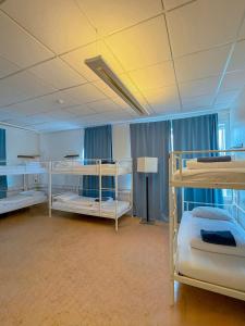 a room with three bunk beds in it at Baron's Hostel in Reykjavík