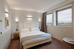 Postel nebo postele na pokoji v ubytování Hotel Plaza + 68 fotografií