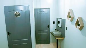 a bathroom with a toilet and a sink at DC Guest House in Avondale +49 photos