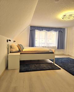 Voodi või voodid majutusasutuse Schneider Appartements Steinhude toas