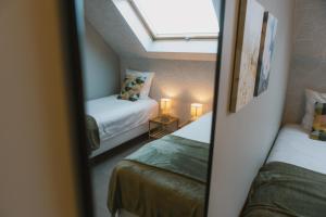 En eller flere senge i et værelse på Appartement De Pereboom