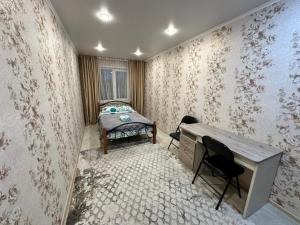 En eller flere senge i et værelse på Lux Home на Амурской