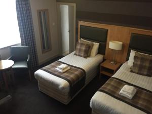 Postel nebo postele na pokoji v ubytování Buchan Hotel