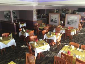 an overhead view of a restaurant with tables and chairs at Buchan Hotel in Ellon