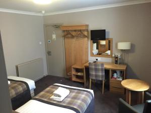 Postel nebo postele na pokoji v ubytování Buchan Hotel