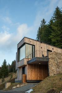 a house on top of a hill with a garage at Chalet Paseka in Pec pod Sněžkou +9 photos