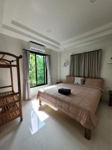 Giường trong phòng chung tại Yangyai Tree Villa