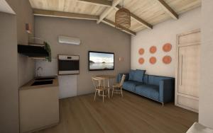 Una sala de estar con un sofá azul y una mesa. en Katoi suite, en Éxo Khóra