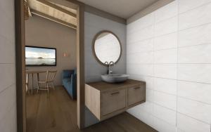 un baño con lavabo y espejo en Katoi suite, en Éxo Khóra 3 fotos más