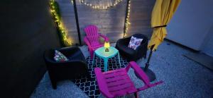 a group of chairs and a table with a lamp at L'Espadon in Luc-sur-Mer +16 photos