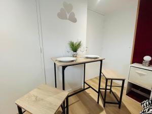 a small room with a table and a chair at Casa Rubis in Les Ponts-de-Cé +3 photos