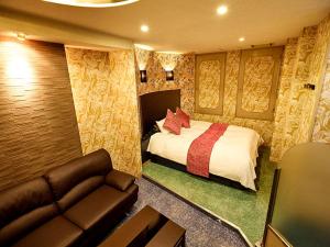 Postel nebo postele na pokoji v ubytování ホテル Liebe 岐阜