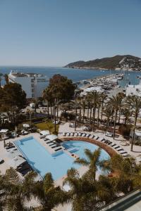 uitzicht op een resort met zwembad en strand bij Aguas de Ibiza Grand Luxe Hotel - Small Luxury Hotel of the World in Santa Eularia des Riu